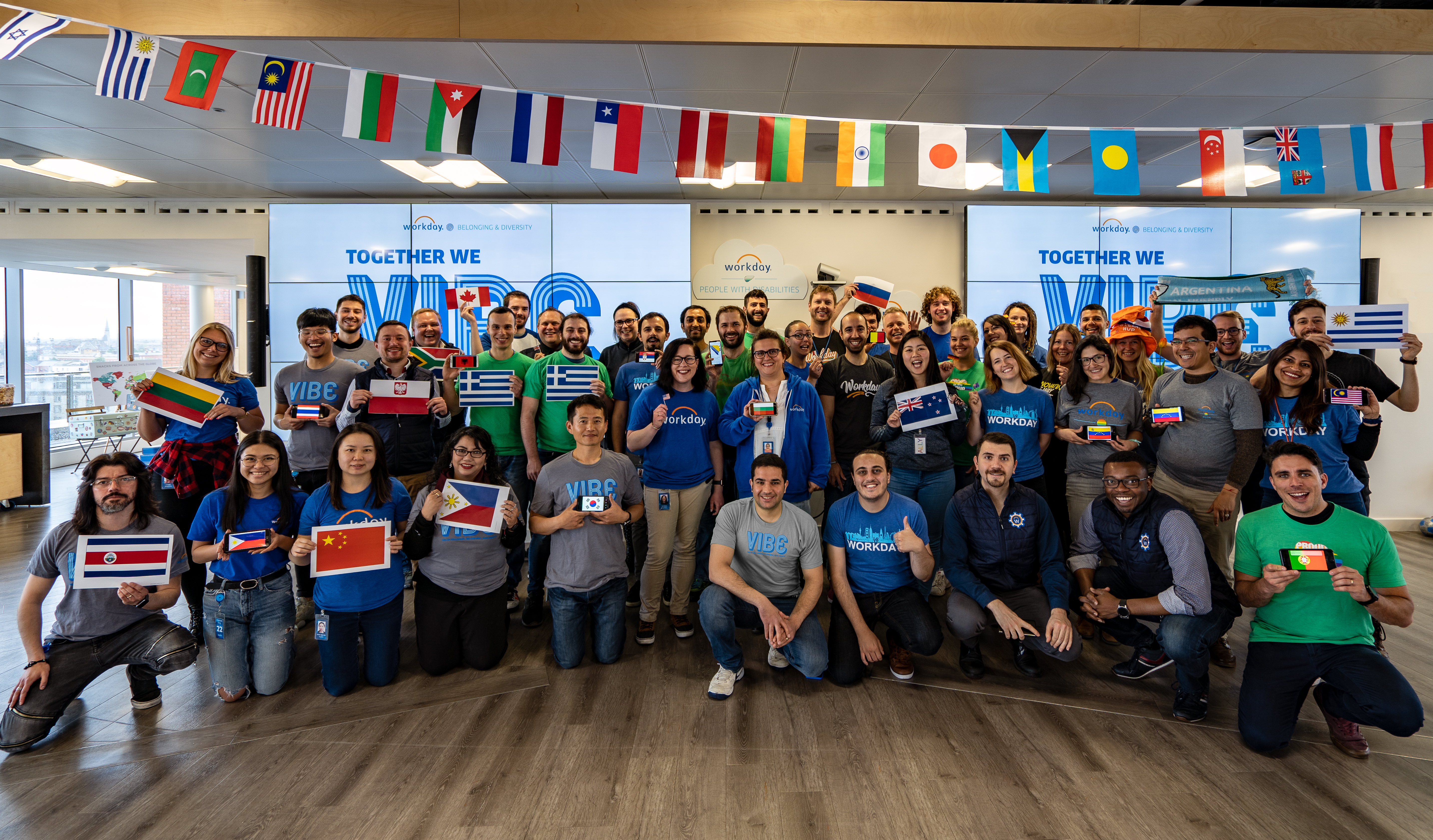 workday employees holding flags
